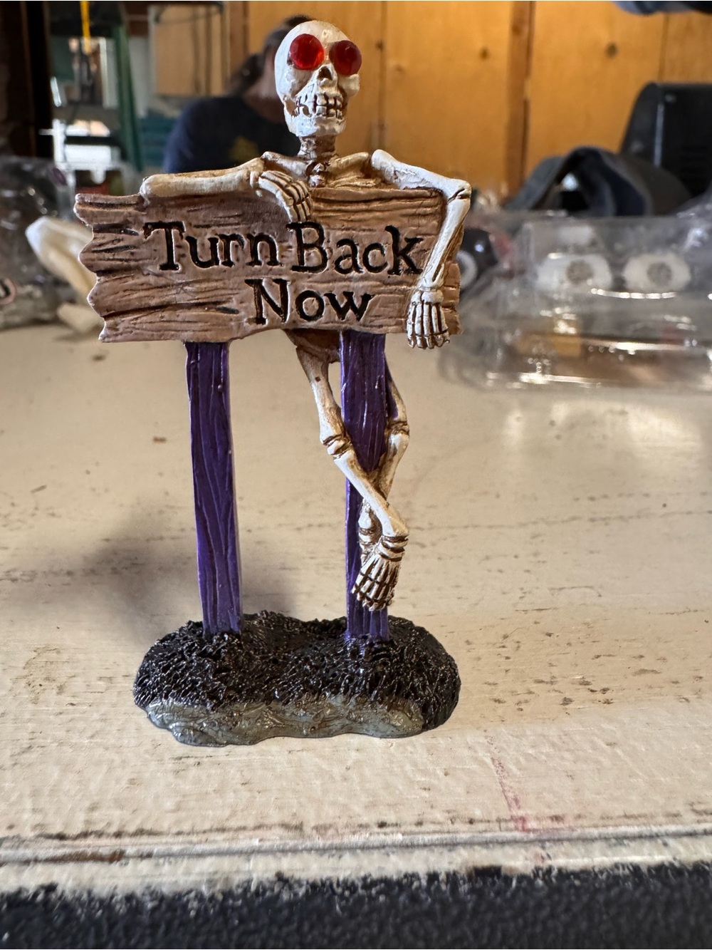Lemax Skeleton 'Turn Back Now' Sign with Red Eyes and Purple Posts